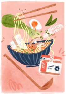 A bowl of ramen and a branded jar of red miso paste